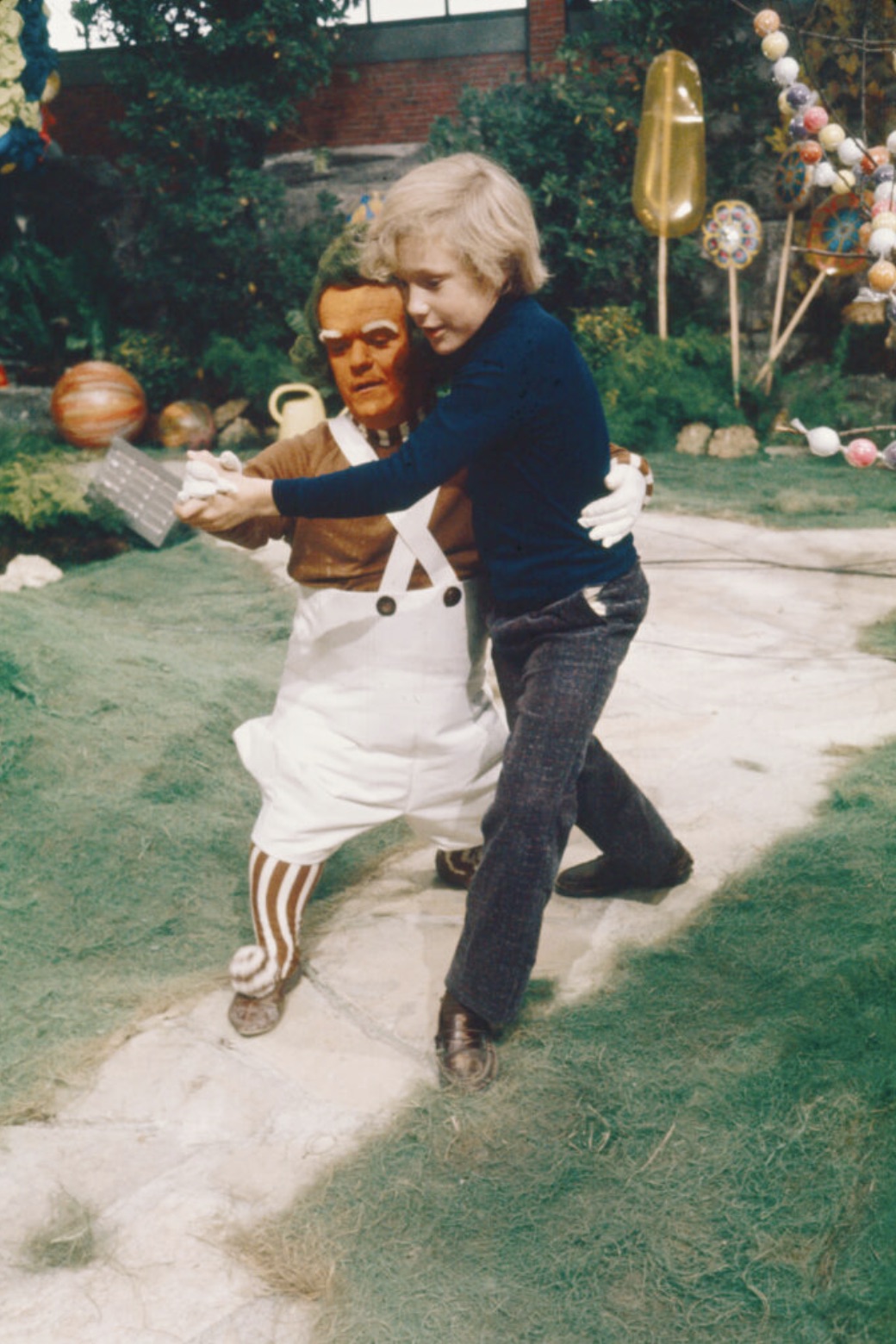 Peter Ostrum waltzing with an Oompa Loompa actor